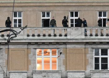 Armed police are seen on the balcony of the university in central Prague, on December 21, 2023. Czech police said Thursday a shooting in a university building in central Prague has left "dead and wounded people", without providing further details.
"Based on the initial information we have, we can confirm dead and wounded people on the scene," police said on X, formerly Twitter. (Photo by Michal CIZEK / AFP)