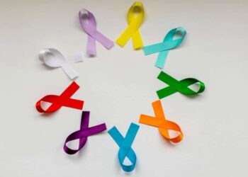 circle with colored ribbons of disease prevention campaigns