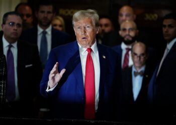 (FILES) Former US President Donald Trump speaks to the press as he attends the New York State Supreme Court during the civil fraud trial against the Trump Organization, in New York City on January 11, 2024. A US judge ordered Trump on February 16, 2024 to pay nearly $355 million after finding him liable for fraud and banned him from running businesses in New York state for three years. (Photo by TIMOTHY A. CLARY / AFP)