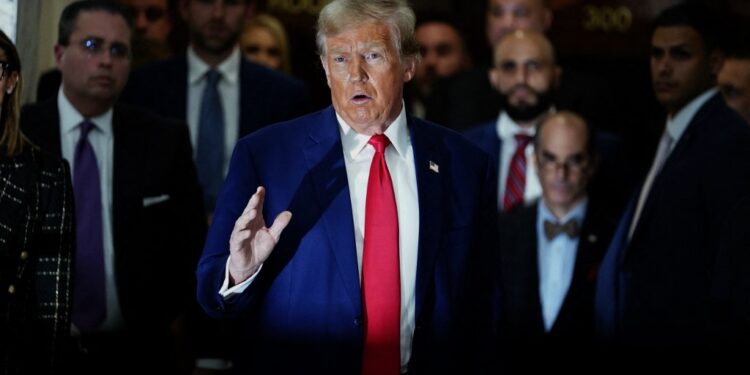 (FILES) Former US President Donald Trump speaks to the press as he attends the New York State Supreme Court during the civil fraud trial against the Trump Organization, in New York City on January 11, 2024. A US judge ordered Trump on February 16, 2024 to pay nearly $355 million after finding him liable for fraud and banned him from running businesses in New York state for three years. (Photo by TIMOTHY A. CLARY / AFP)