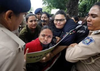 Police officers detain demonstrators during a protest against the alleged sexual assault of two tribal women in the eastern state of Manipur, in Ahmedabad, India, July 23, 2023. REUTERSAmit Dave.