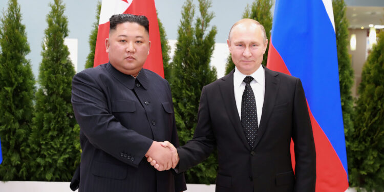 FILE PHOTO: North Korean leader Kim Jong Un shakes hands with Russian President Vladimir Putin in Vladivostok, Russia in this undated photo released on April 25, 2019 by North Korea's Central News Agency (KCNA). KCNA via REUTERS