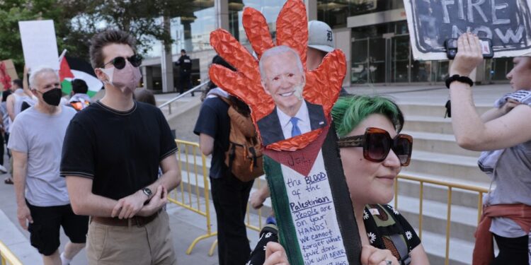 Pro-Palestinian demonstrators protest as US President Joe Biden attends the NAACP Freedom Fund dinner in Detroit, Michigan on May 19, 2024. US President Joe Biden called May 19, 2024 for an immediate ceasefire in Gaza and said he was working on a "lasting, durable peace" that would include the creation of a Palestinian state. Speaking at a graduation ceremony at the former university of civil rights icon Martin Luther King, Jr, Biden said he was pushing for a regional peace deal "to get a two-state solution, the only solution." (Photo by JEFF KOWALSKY / AFP)