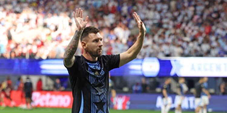 Argentina's forward #10 Lionel Messi acknowledges supporters as he warms up ahead of the Conmebol 2024 Copa America tournament group A football match between Argentina and Canada at Mercedes Benz Stadium in Atlanta, Georgia, on June 20, 2024. (Photo by CHARLY TRIBALLEAU / AFP)