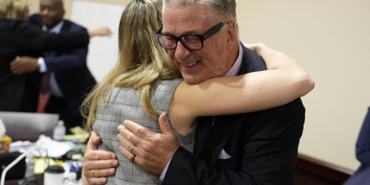 Santa Fe (United States), 12/07/2024.- US actor Alec Baldwin hugs a member of his legal team at the conclucion of his trial on involuntary manslaughter at Santa Fe County District Court in Santa Fe, New Mexico, USA, 12 July 2024. In October 2021, on the New Mexico set of the Western movie 'Rust', a gun pointed by Baldwin discharged a live round, killing the film's cinematographer Halyna Hutchins and wounding its director. Baldwin's trial for involuntary manslaughter was dismissed by a judge on 12 July after she ruled that key evidence over a fatal shooting on the set of 'Rust' had been withheld from the defense. (Cine) EFE/EPA/RAMSAY DE GIVE / POOL