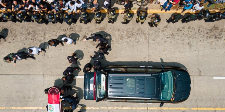 The coffin of late Peru's former president Alberto Fujimori arrives for his wake at the Culture Ministry in Lima on September 12, 2024. - Peru's former president Alberto Fujimori, who ruled his country with an iron fist and then spent 16 years in prison for crimes against humanity, died on Wednesday at age 86 in the capital Lima. (Photo by Juan Carlos CISNEROS / AFP)