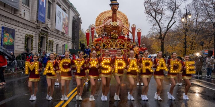 Cheerleaders perform in the rain during the annual Macy's Thanksgiving Day Parade in New York City on November 28, 2024. (Photo by David Dee Delgado / AFP)