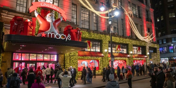 People line up outside of Macy's flagship store before opening on Black Friday, in New York City on November 29, 2024. - The annual Black Friday shopping day has always been about finding the best deals, but this year retailers are preparing for a US consumer more zealously fixated than ever on getting value for their money. (Photo by Adam GRAY / AFP)