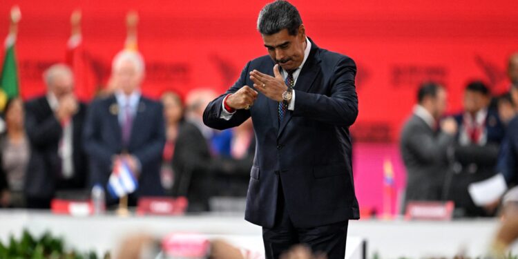 Venezuela's President Nicolas Maduro gestures during the opening session of the XXIV ALBA-TCP Summit in Caracas on December 14, 2024. - The Bolivarian Alliance for the Peoples of Our America (ALBA) celebrates its 20th anniversary in a regional context where its influence is increasingly diminishing. The summit, originally planned in Havana where the founding document was signed, was moved to the Venezuelan capital at the peak of an economic crisis that is hitting Cuba. (Photo by Juan BARRETO / AFP)