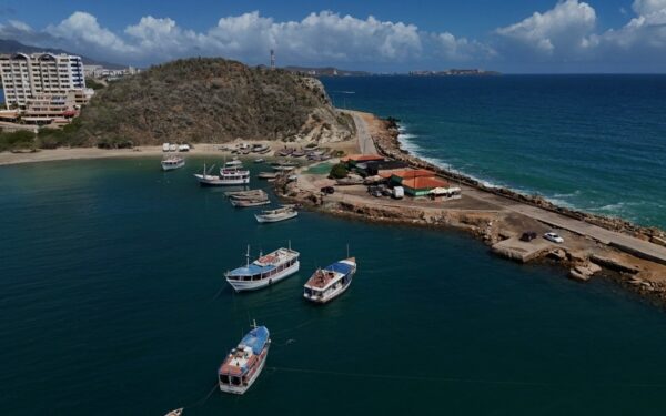 Aerial view of Pier Juan Griego in Margarita Island, Nueva Esparta State, Venezuela, on November 25, 2024. - Margarita, Venezuela's main island, is a Caribbean paradise in decline after years of devaluations, inflation, a pandemic, and the collapse of public services. (Photo by Juan BARRETO / AFP)